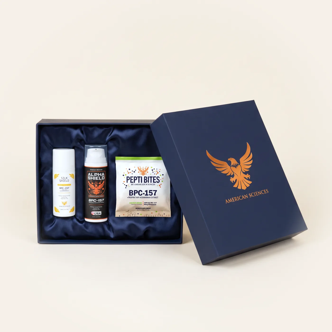 Packaging concept showing the Complete Bundle products in a silk-lined navy gift box